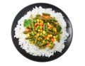 black plate with white rice, green peas, canned corn kernels, cut green beans isolated on white background. top view Royalty Free Stock Photo