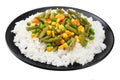 black plate with white rice, green peas, canned corn kernels, cut green beans isolated on white background Royalty Free Stock Photo