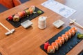 black plates with delicious sushi rolls Royalty Free Stock Photo