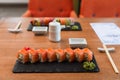 black plates with tasty sushi rolls Royalty Free Stock Photo