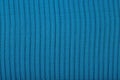 Black pleated transparent caprone cloth on a blue background