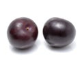 Black plums isolated on white background Royalty Free Stock Photo