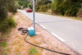 Black pneumatic tube along the road to measure speed and number of vehicles