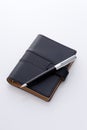 Black pocket diary and pen