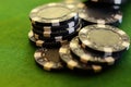 Black Poker Chips on Green Felt Royalty Free Stock Photo