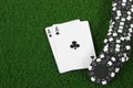 Black poker cihps and two aces Royalty Free Stock Photo