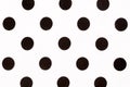 Black polka dot over white fabric background. High quality texture. Royalty Free Stock Photo