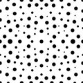 Black polka dots pattern on white background in diffrent size