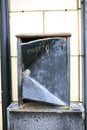 Black postbox in a white wall Royalty Free Stock Photo