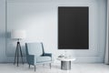 Black poster with copyspace in modern leaving room with stylish armchair, black and white lamp and coffee table. Mock up Royalty Free Stock Photo