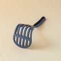 Black potato masher on background. Kitchenware. Pusher for mashed Royalty Free Stock Photo