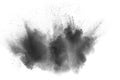 Black powder explosion against white background. Charcoal dust particles exhale in the air