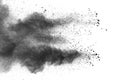 Black powder explosion. The particles of charcoal splatter on white background. Royalty Free Stock Photo