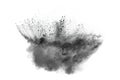 Black powder explosion. The particles of charcoal splatter on white background. Royalty Free Stock Photo