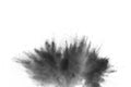 Black powder explosion. The particles of charcoal splatter on white background. Closeup of black dust particles splash isolated on Royalty Free Stock Photo