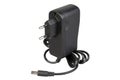 Black power adapter with cable and DC power supply connector for low current devices. Royalty Free Stock Photo