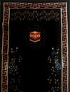 The black prayer rug is a device made of cloth that usually has an Islamic image and style. Prayers are used by Muslims to keep Royalty Free Stock Photo