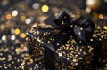 a black present with gold and ribbons