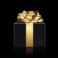 Black present with the golden ribbon on dark background. Gift box for Christmas, New Year`s Day, Birthday, Valentines Royalty Free Stock Photo