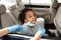 Black Preteen Girl Getting Tested For Covid-19 Sitting In Car Royalty Free Stock Photo