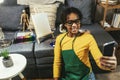 Black preteen girl happily at a table, surrounded by an array of creative materials for painting to inspire their next great idea.