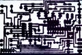 black printed circuit board tracks white background