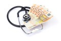 Black professional stethoscope with euro money on white Royalty Free Stock Photo