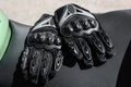 Black protective gloves for a motobiker with plastic inserts. Royalty Free Stock Photo