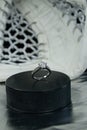 Engagement Ring on hockey puck with the inscription `Czech Republic` on the SILVER background. Royalty Free Stock Photo