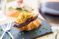 Black pudding and onion tapa. A small slice of bread on which a small portion of food is placed is called a skewer. Royalty Free Stock Photo