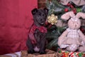 Black puppy and toy bunny Royalty Free Stock Photo