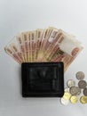 Black purse with paper and iron money top view Royalty Free Stock Photo