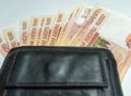 Black purse with paper and iron money top view Royalty Free Stock Photo