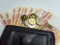 Black purse with paper and iron money top view Royalty Free Stock Photo