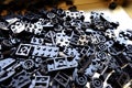 Black puzzle legos in golden box for educattion Royalty Free Stock Photo