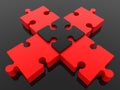 A black puzzle piece as a link between red puzzle pieces Royalty Free Stock Photo