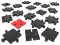 Black puzzle pieces with one red piece in the middle Royalty Free Stock Photo