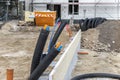 Black PVC flexible corrugated plastic insulation pipes tubing of electrical cables wire at undeground installation. New