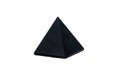 Black pyramid made of obsidian stone. Isolated on white background Royalty Free Stock Photo
