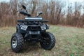 black quad bike on green grass.