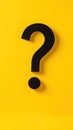 Black question mark on bright yellow background. Simple, modern design. Business concept for finding solutions to problems Royalty Free Stock Photo