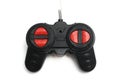 A black radio control RC remote controller with red buttons and a fine antenna Royalty Free Stock Photo