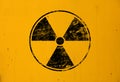 Black radioactive sign over yellow background Royalty Free Stock Photo