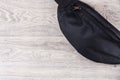 Black rag bag on a light wooden background Royalty Free Stock Photo