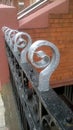 Black railings with silver finials