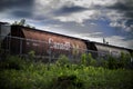 Red railway tanker cars of the type used to transport petroleum products