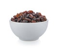 Black raisin on white bowl isolated on white background Royalty Free Stock Photo