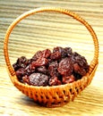 Black raisin in wicker basket