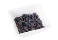 Black raisins in a white bowl. Royalty Free Stock Photo