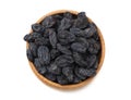 black raisins in wooden bowl isolated on white background. top view Royalty Free Stock Photo